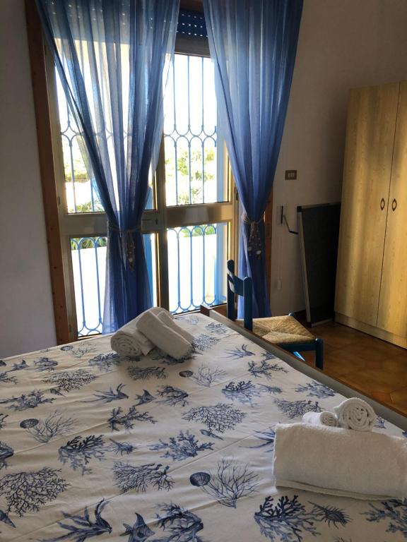 A bed or beds in a room at La sirenetta bellicosa