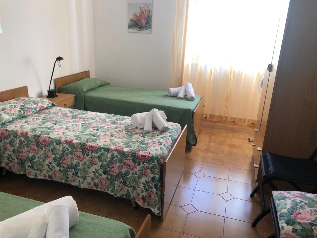 A bed or beds in a room at La sirenetta bellicosa