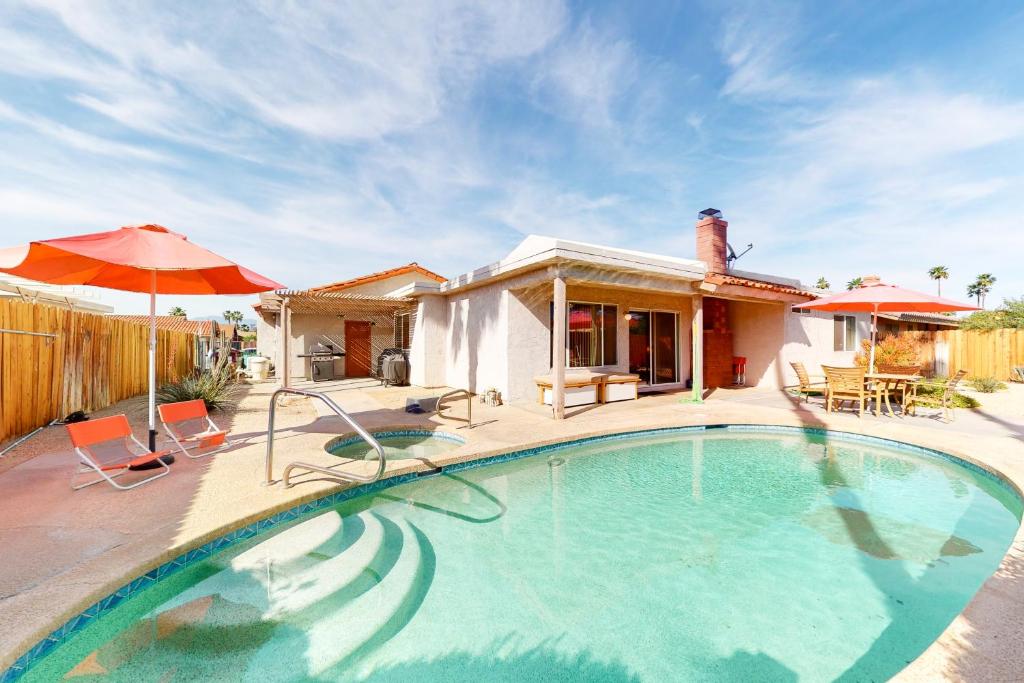 a swimming pool in front of a house at Coachella Hideout Permit# 50423 in Indio