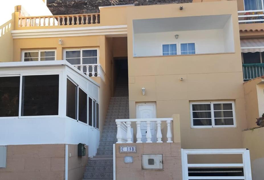 a house with a staircase in front of it at Casa Filo, maravilloso apartamento en Morro Jable in Morro del Jable