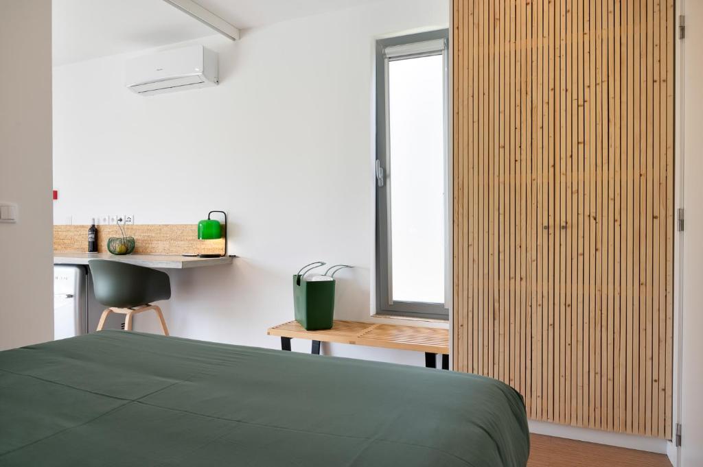 Postel nebo postele na pokoji v ubytování Flamboyant Boutique B&B