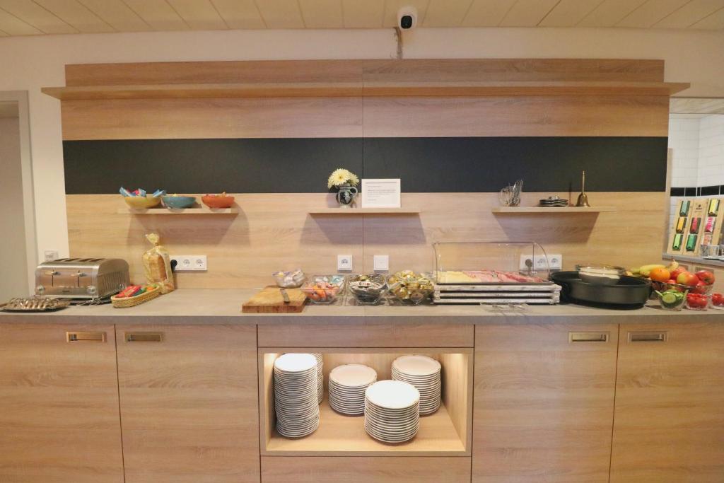 Kuchyň nebo kuchyňský kout v ubytování Hotel Franken
