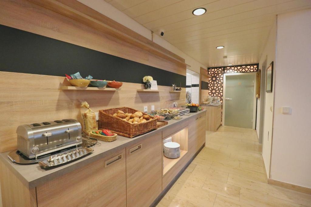 Kuchyň nebo kuchyňský kout v ubytování Hotel Franken