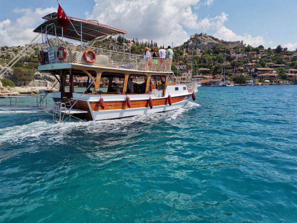 a boat in the water with people on it at Kekova Private Boat Tour in Demre