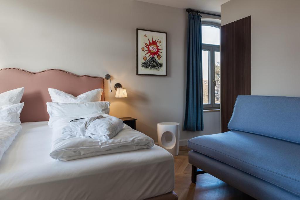 Postel nebo postele na pokoji v ubytování Mimosa Suites