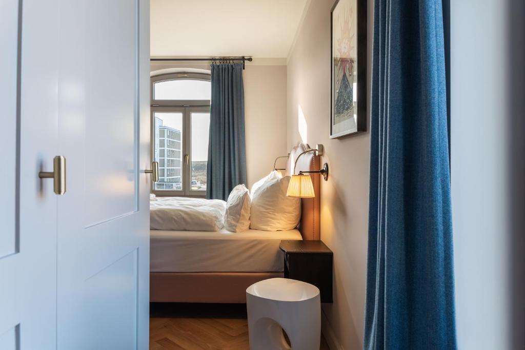 Postel nebo postele na pokoji v ubytování Mimosa Suites