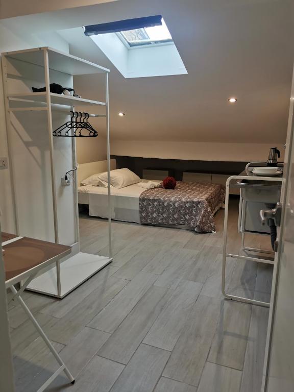 A bed or beds in a room at Alle Mansarde