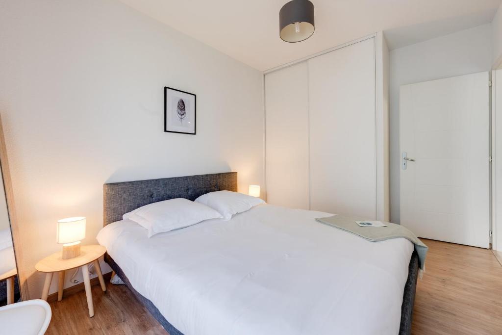 Postelja oz. postelje v sobi nastanitve Au fil du Thiou - 2 bedrooms - Parking