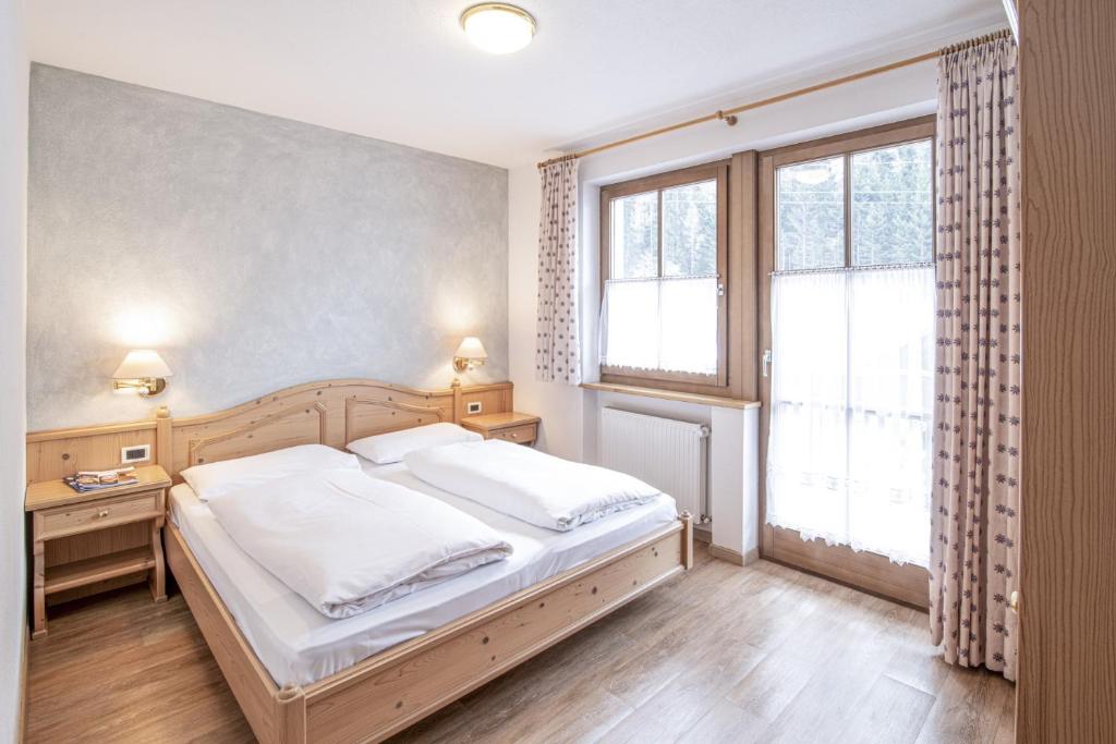 Postel nebo postele na pokoji v ubytování Hotel Residence Rose