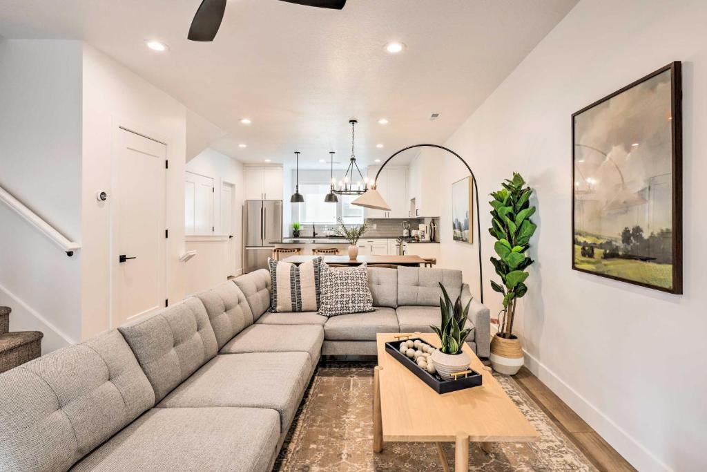 a living room with a couch and a table at Modern-Chic Provo Townhome 1 Mi to BYU Campus in Provo