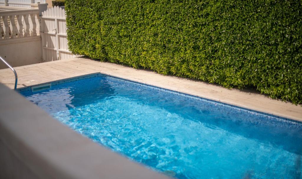 The swimming pool at or close to R126 Beachfront Apartment Sant Salvador