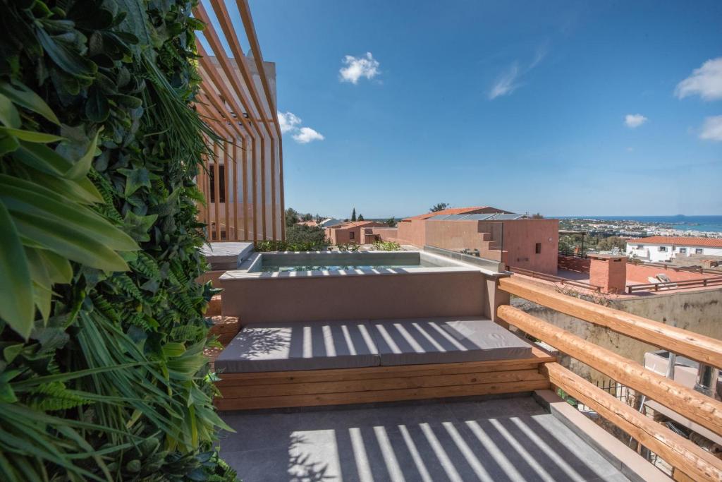 a rooftop balcony with a view of the city at Cataphari Luxury Villa in Hersonissos