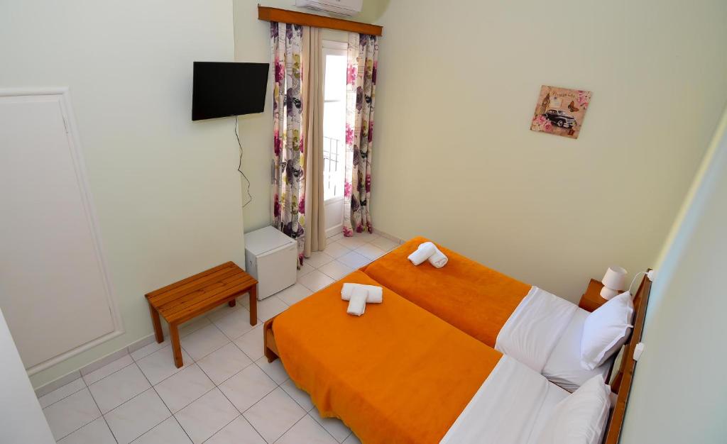 Postel nebo postele na pokoji v ubytování Costa Hotel