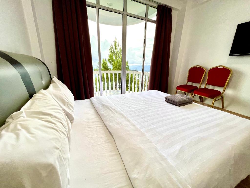 Postel nebo postele na pokoji v ubytování JR RESORT