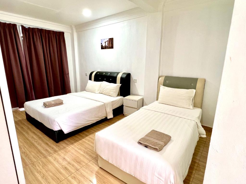 Postel nebo postele na pokoji v ubytování JR RESORT