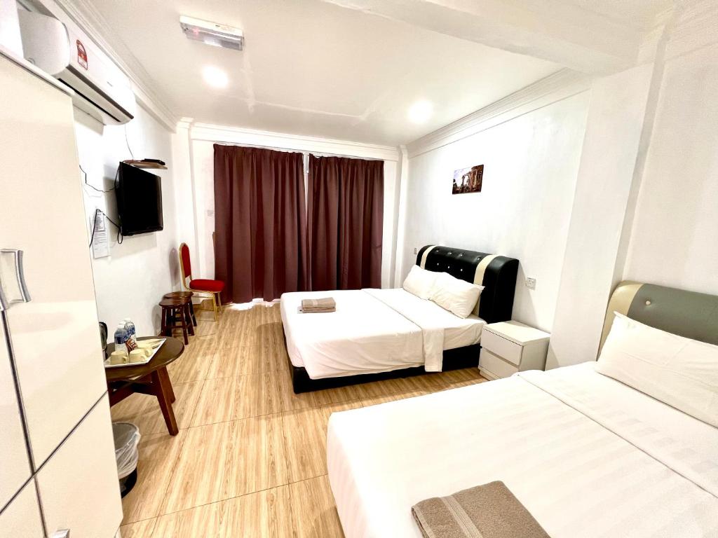 Postel nebo postele na pokoji v ubytování JR RESORT