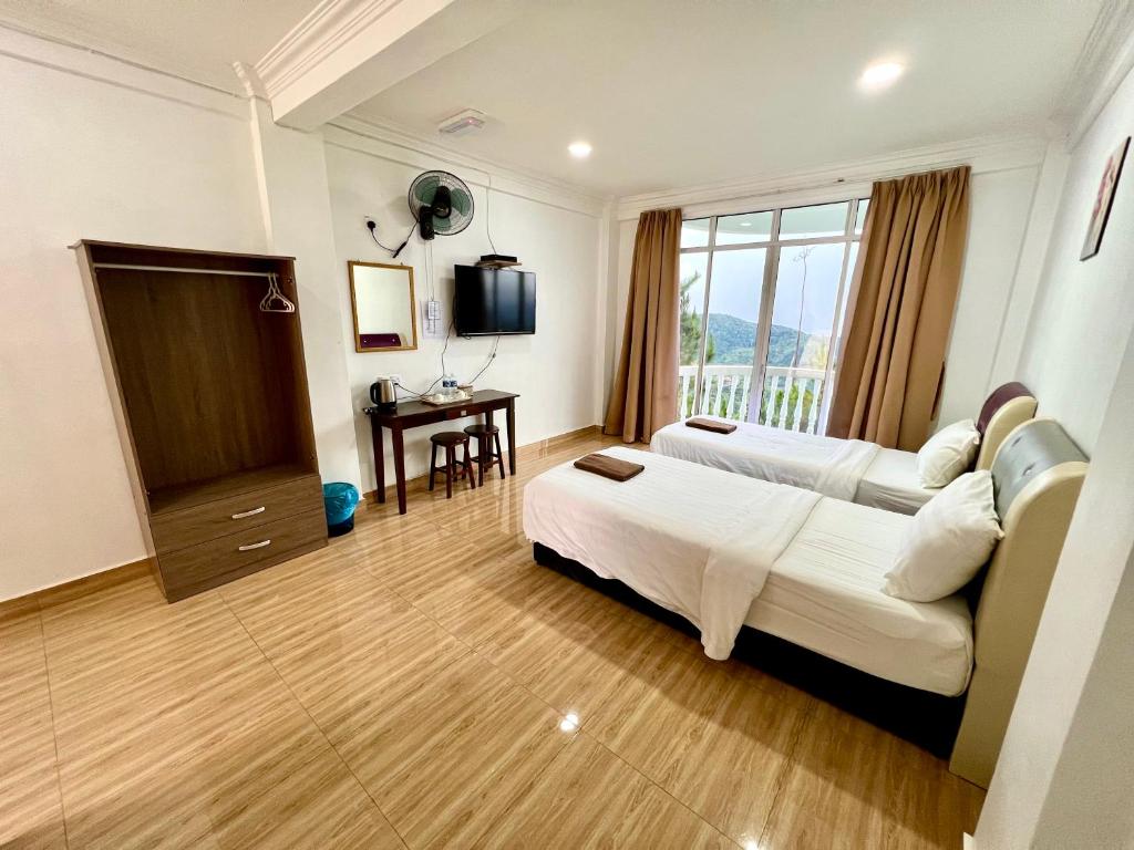 Postel nebo postele na pokoji v ubytování JR RESORT