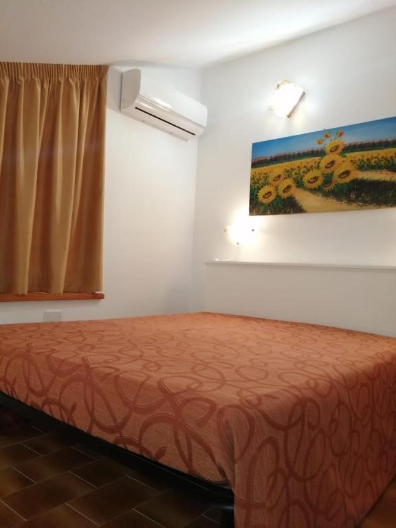 Postel nebo postele na pokoji v ubytování Mansarda sul Lago a Marta