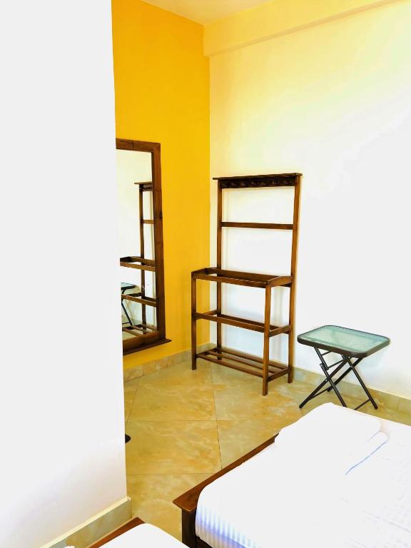Postel nebo postele na pokoji v ubytování Hansons Homestay