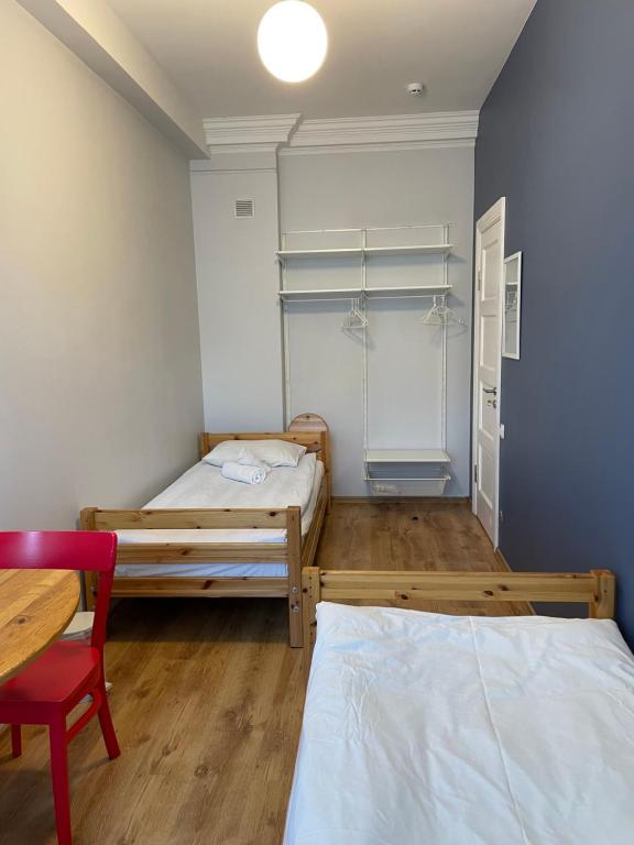 Postel nebo postele na pokoji v ubytování Orange Cat Rooms