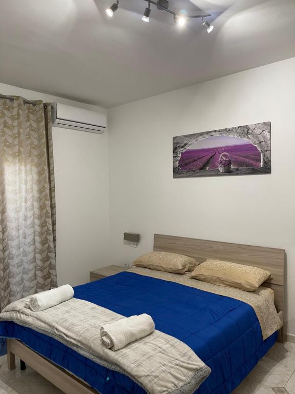 Ένα ή περισσότερα κρεβάτια σε δωμάτιο στο Oreto Apartment