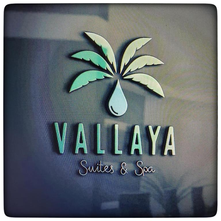 a logo with a drop of water on a palm tree at Le Vallaya Suites & Spa in Menton