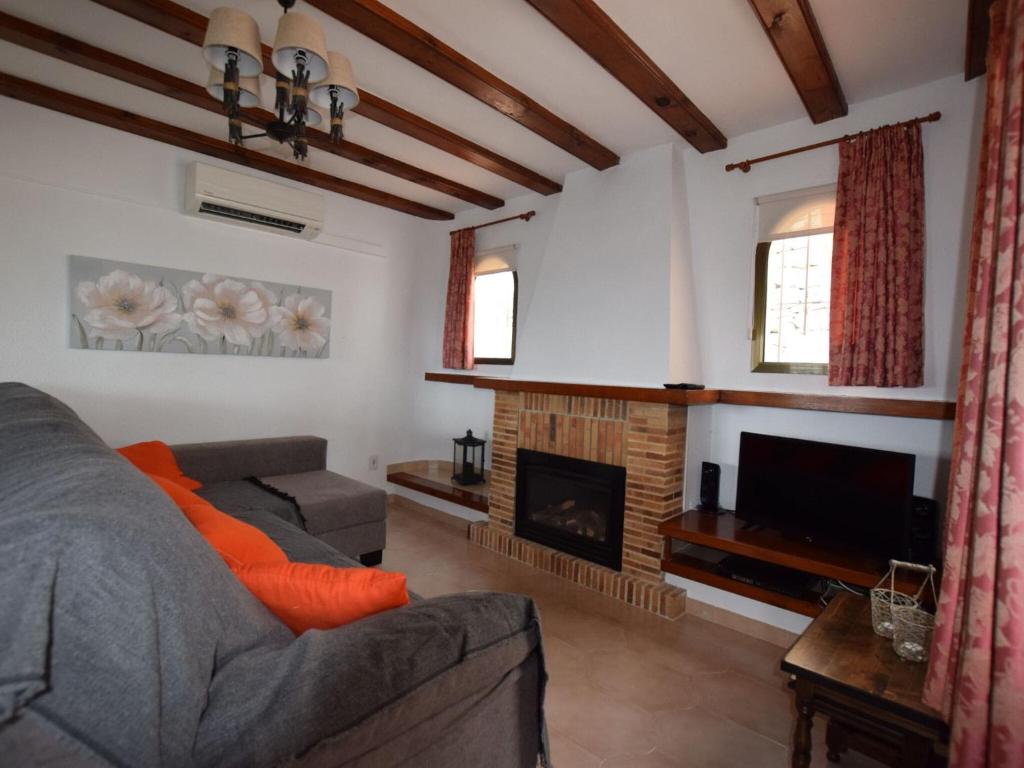 A television and/or entertainment centre at Villa with private pool in Benitachell