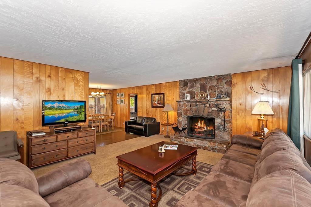 a living room with a couch and a fireplace at 049 - Mountain Time in Big Bear Lake