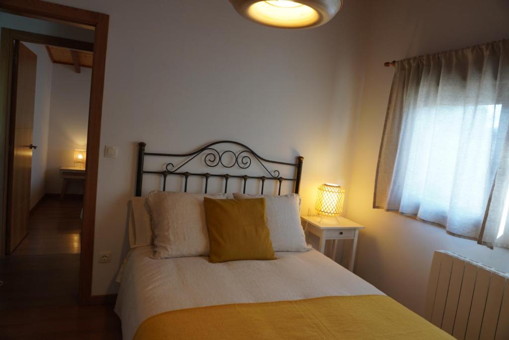 Postel nebo postele na pokoji v ubytování Pedra Moura Casa Rural
