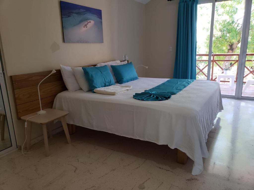 Postel nebo postele na pokoji v ubytování Paradise Island Beach Resort