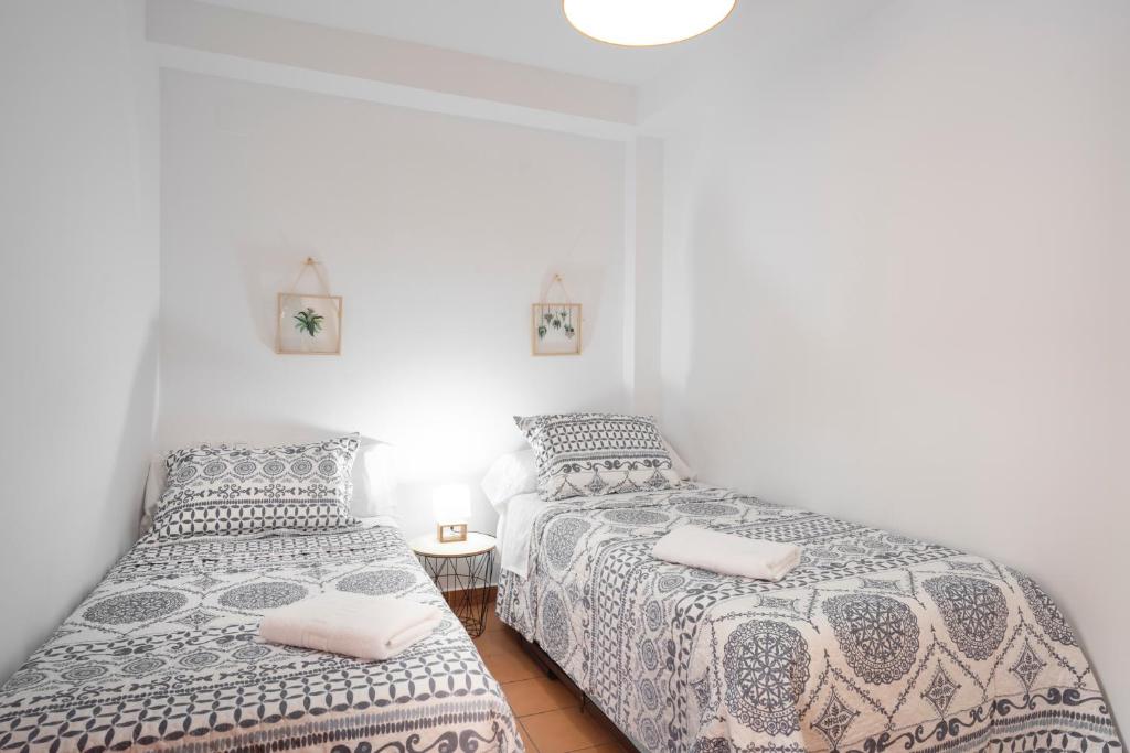 Posteľ alebo postele v izbe v ubytovaní ELVIRA 60 Homes
