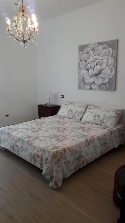 Posteľ alebo postele v izbe v ubytovaní Pecciolo Port Apartaments