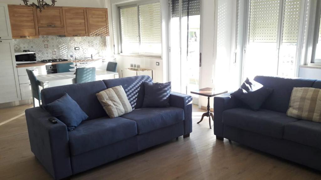 Posedenie v ubytovaní Pecciolo Port Apartaments
