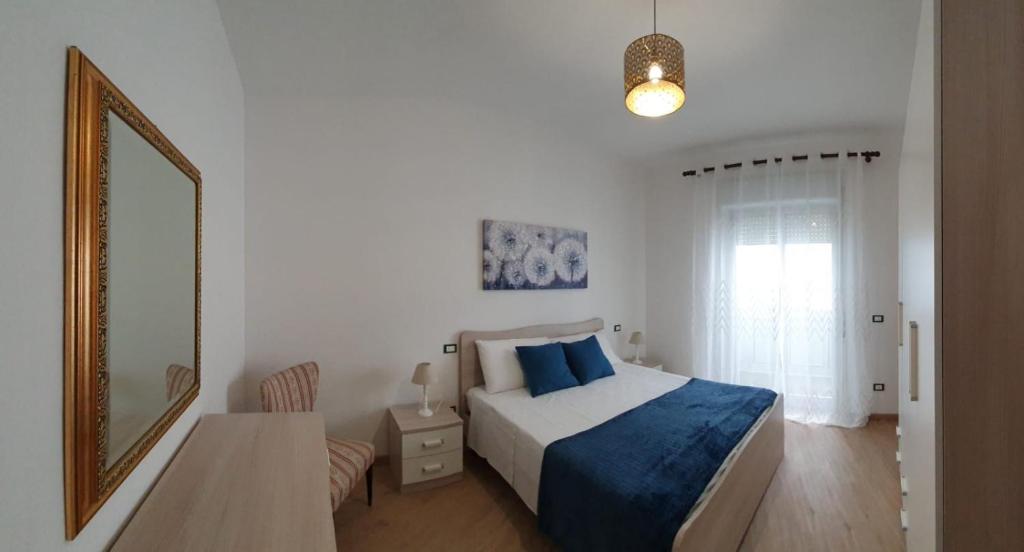 Posteľ alebo postele v izbe v ubytovaní Pecciolo Port Apartaments