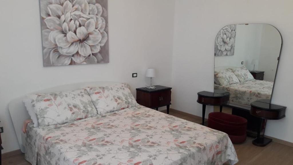Posteľ alebo postele v izbe v ubytovaní Pecciolo Port Apartaments