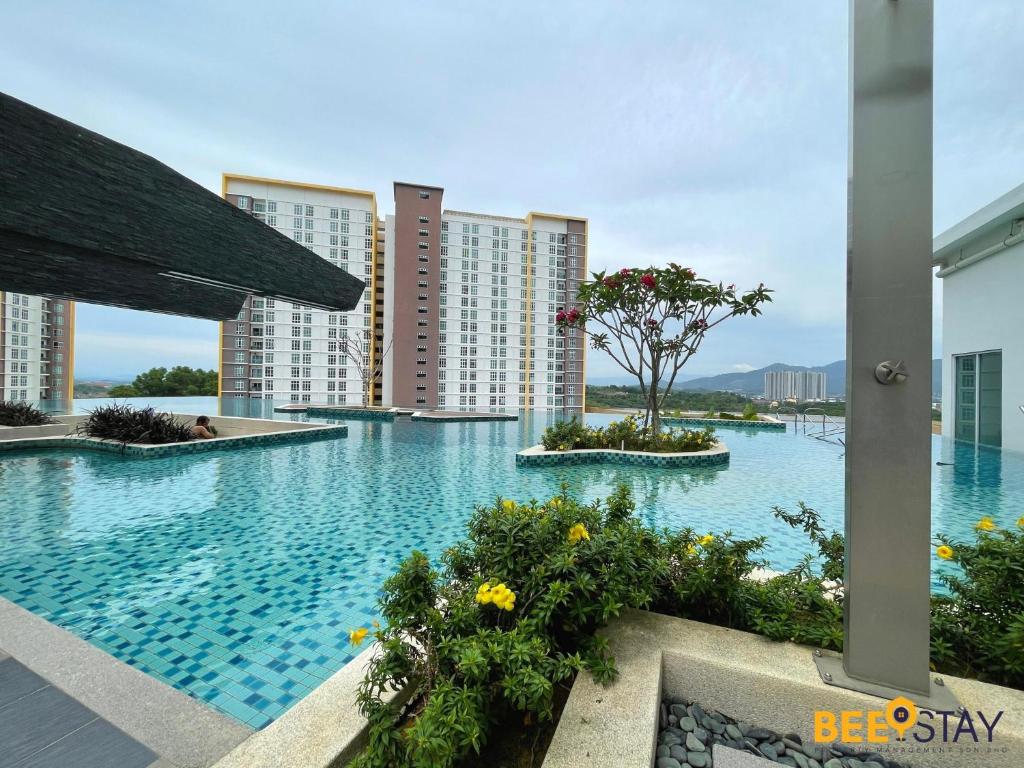 a large swimming pool in the middle of a building at Mesa Hill Nilai by Beestay Management in Nilai
