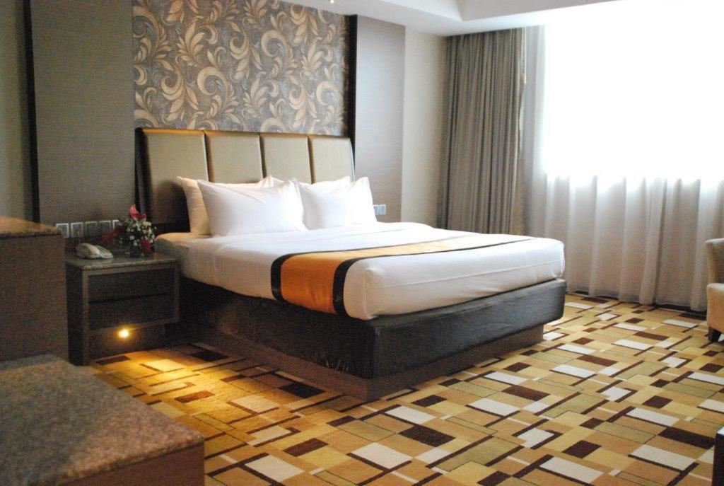 Tempat tidur dalam kamar di Grand Paragon Hotel Johor Bahru