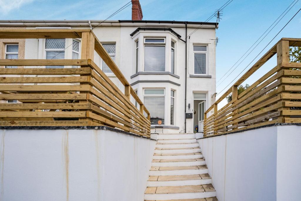 a stairway leading to a house with a fence at 76A Mackworth Road in Porthcawl