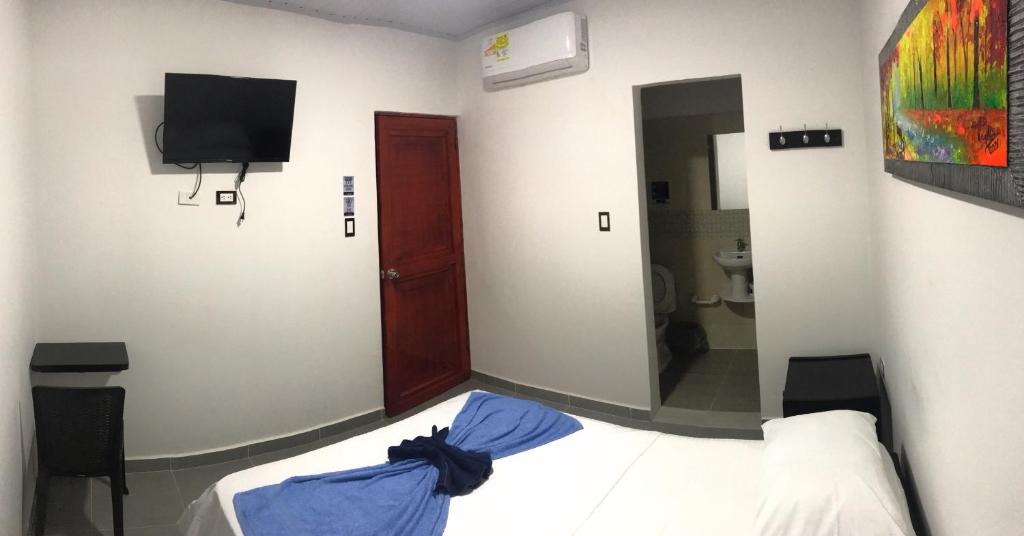 Ένα ή περισσότερα κρεβάτια σε δωμάτιο στο Hotel Inmaculada Real