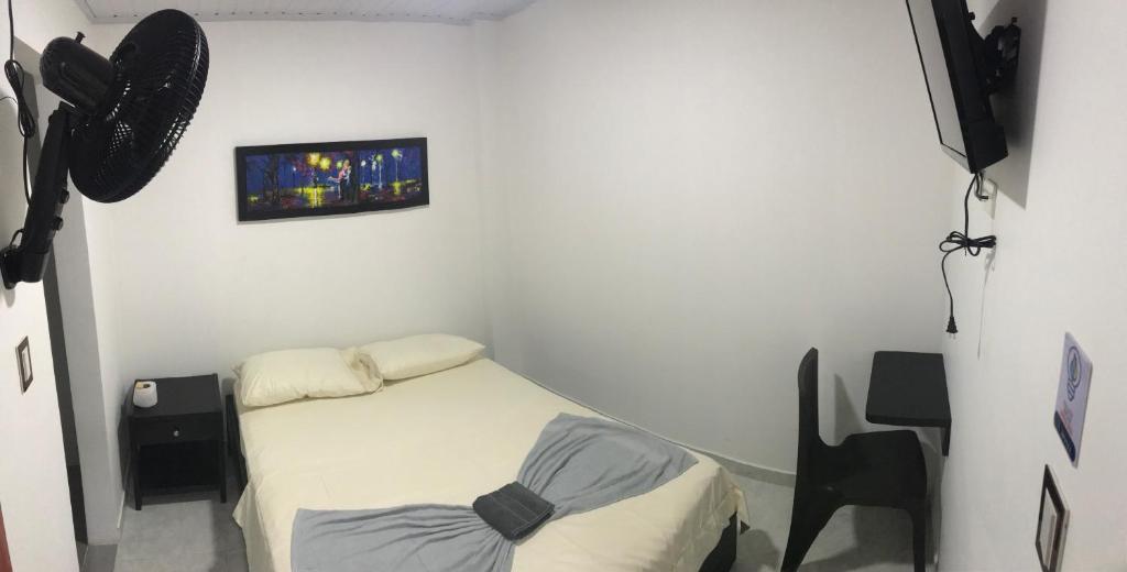 Postel nebo postele na pokoji v ubytování Hotel Inmaculada Real