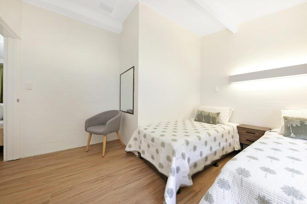 Postel nebo postele na pokoji v ubytování Kinka Palms Motel