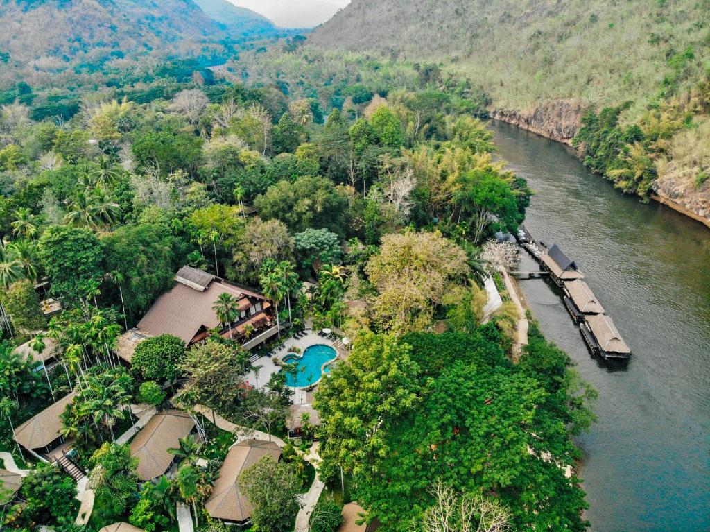 an aerial view of a resort next to a river at River Kwai Resotel - SHA Extra Plus in Sai Yok