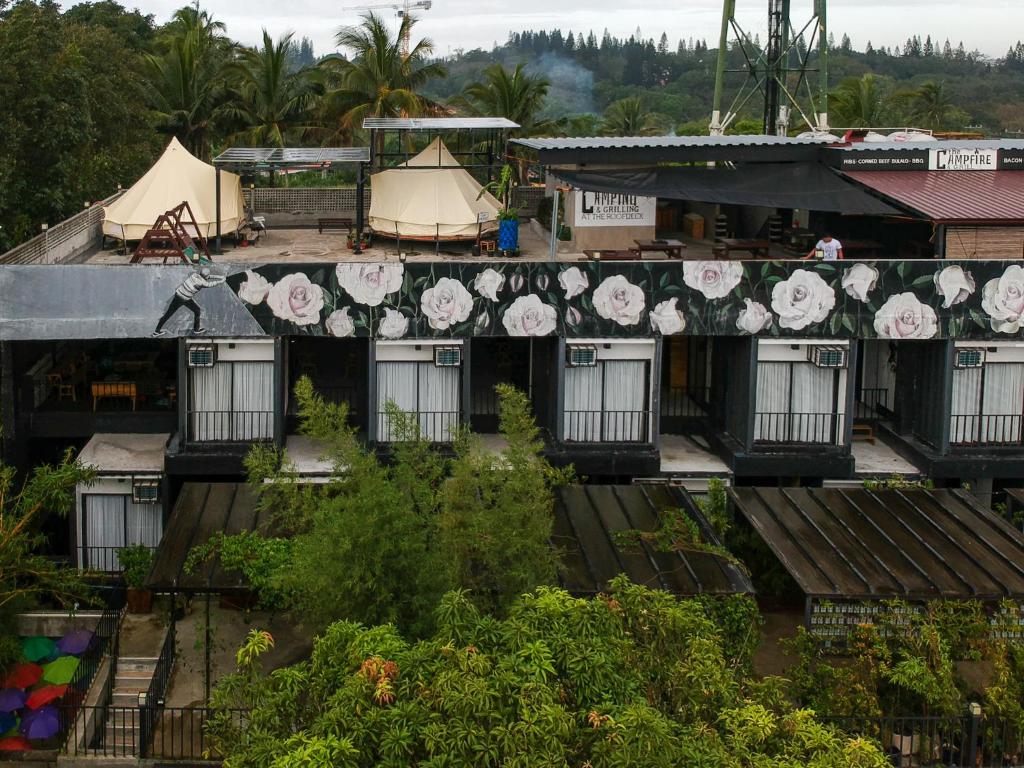 an overhead view of a building with flowers on it at Containers by Eco Hotel in Tagaytay