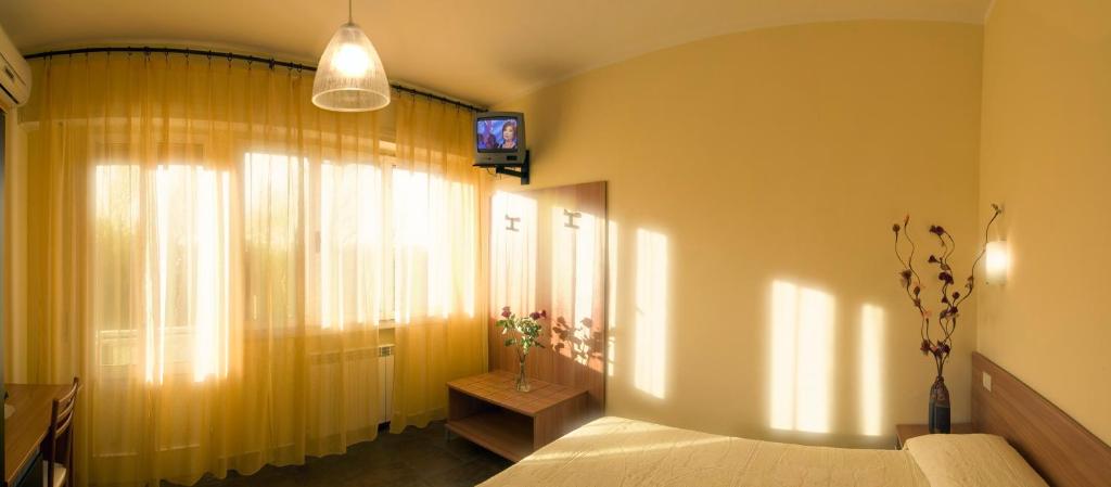 Postel nebo postele na pokoji v ubytování Hotel Il Cavaliere Nero