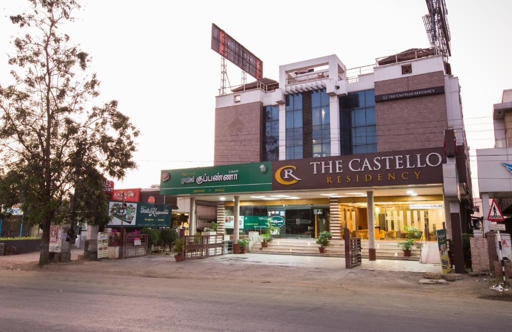 a store on a street in front of a building at THE CASTELLO RESIDENCY in Coimbatore