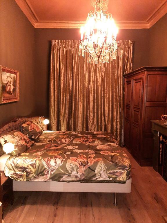 Postel nebo postele na pokoji v ubytování Sint Andries Suites