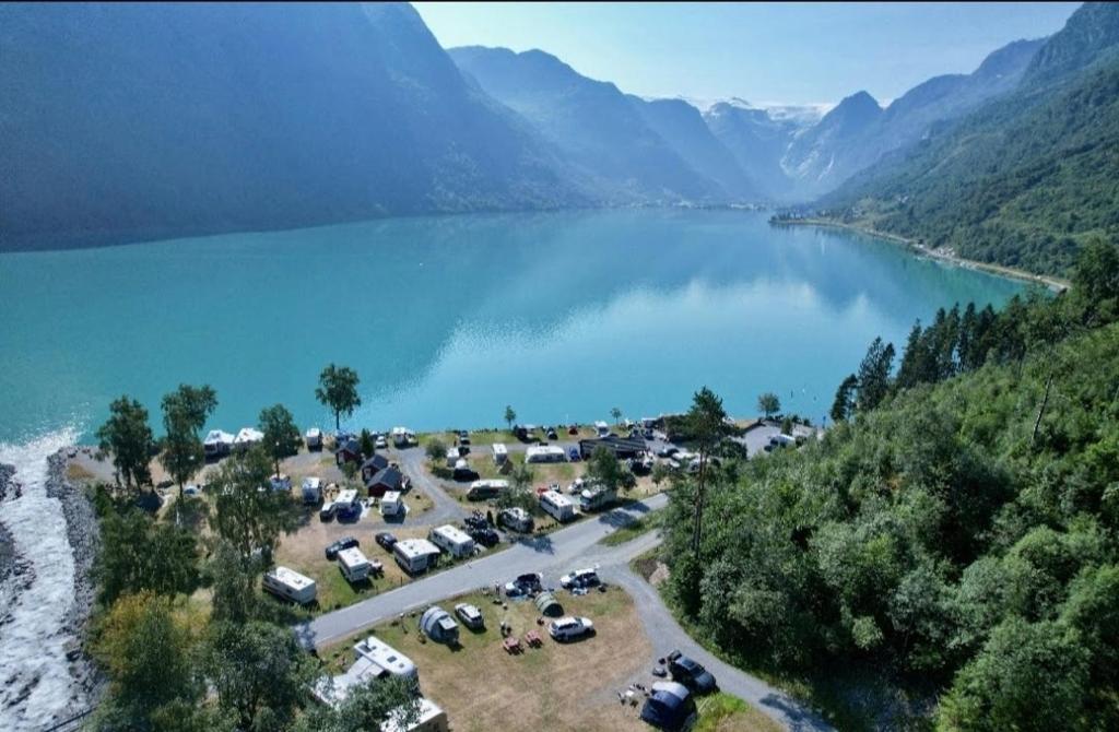 an aerial view of a parking lot next to a lake at Olden Camping in Olden