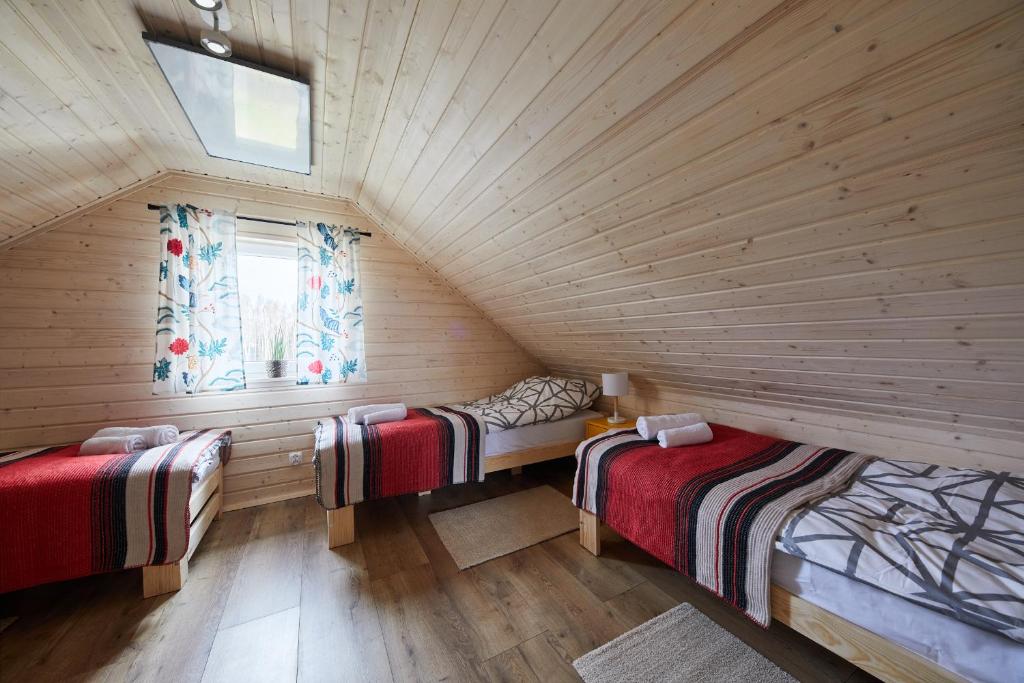 Posteľ alebo postele v izbe v ubytovaní Apartamenty Białe Brzozy