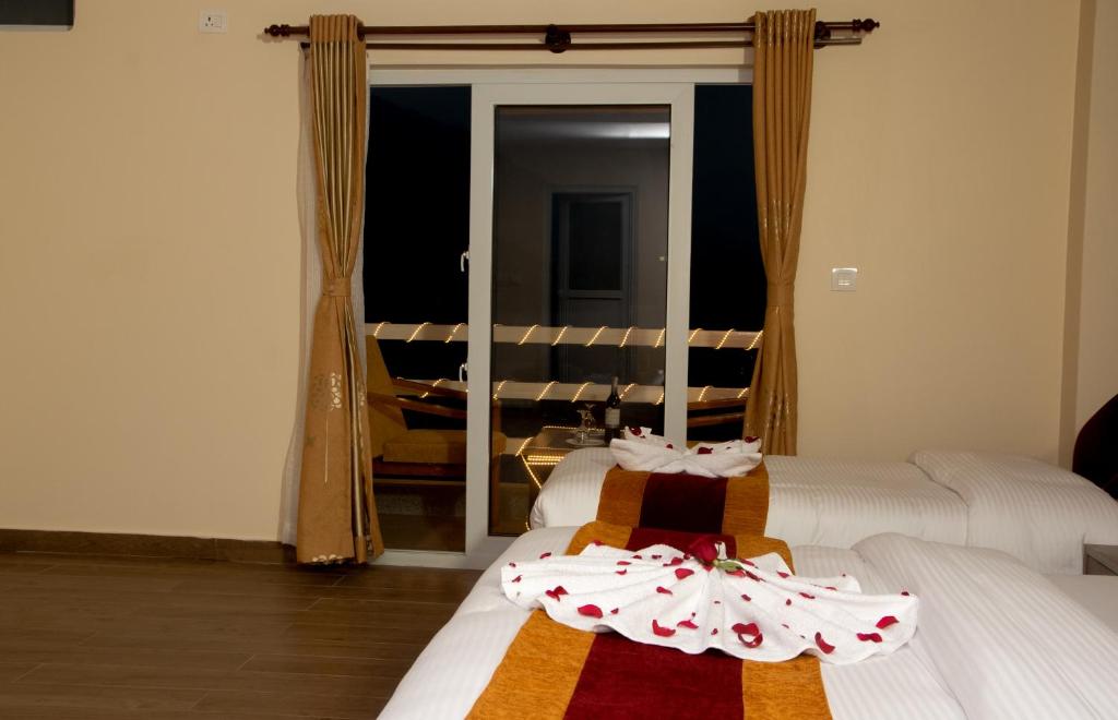 En eller flere senger på et rom på Hotel Murano