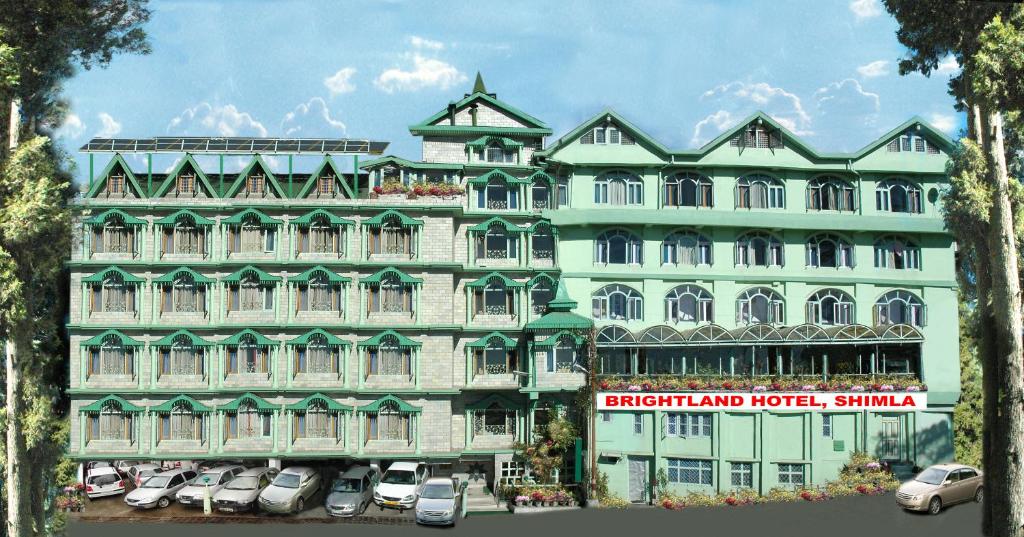 a large building with cars parked in front of it at Brightland Hotel near Mall Road - Stags entry not allowed in Shimla